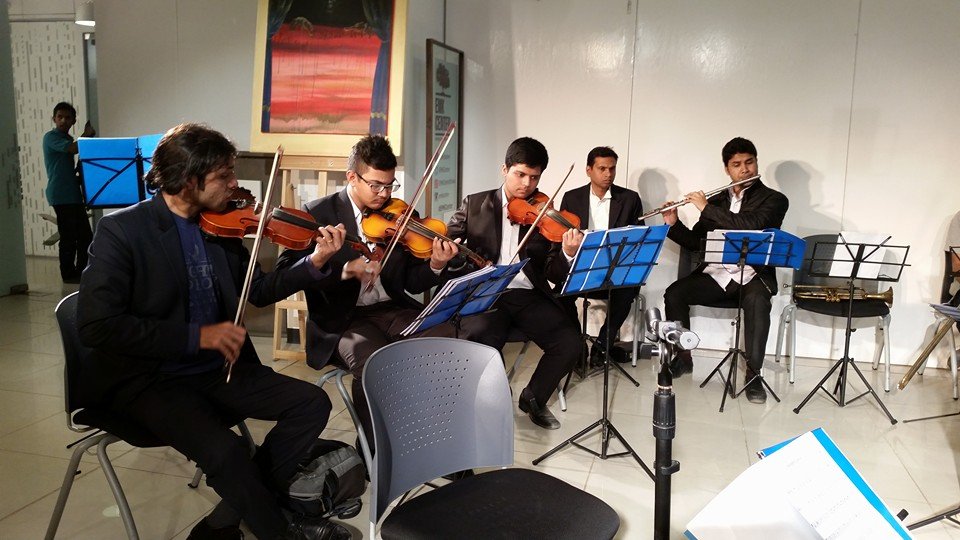 Classical Music Academy musicians rehearsing with music stands